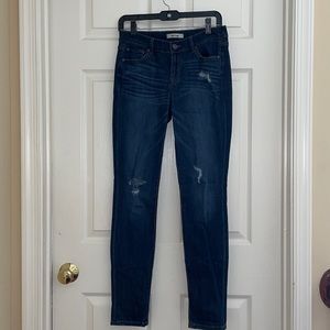 Dark blue skinny jeans with rips